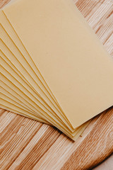 Lasagna sheets, durum wheat pasta on a wooden surface.