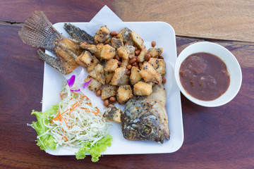 Deep fried batter fish served with vegetables and tamarind sauce