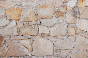 Texture of a stone wall. Old stone wall texture background. Stone wall as a background or texture. Greek stone wall.
