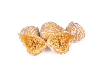 whole and haft cut small dried figs on white background
