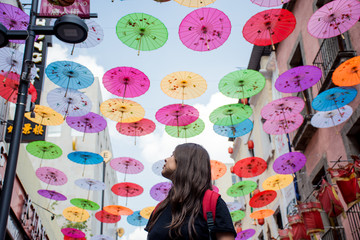 A young woman walks at Chinatown