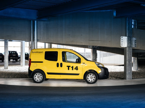 BASEL, SWITZERLAND - MAR 22, 2018: EuroAirport yellow service FIAT van inside modern parking