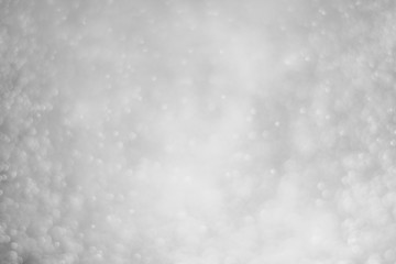 Abstract bokeh glitter white light background.