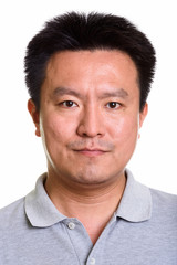 Obraz premium Studio shot of Japanese man isolated against white background