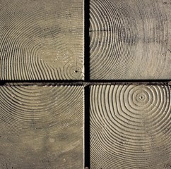 Top view of a textured wooden bench seat.