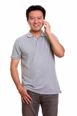 Studio shot of Japanese man isolated against white background