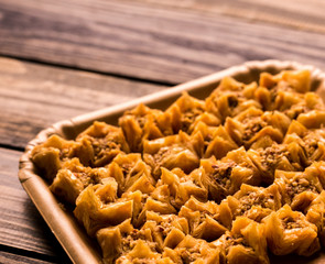 turkish baklava on a vintage wooden table