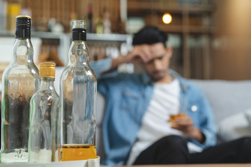 Alcoholism concept. Young man drinking alcohol too much.
