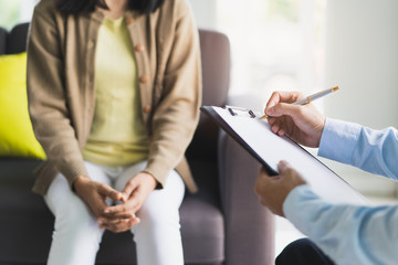 psychologist talking with depressed patient about mental condition.