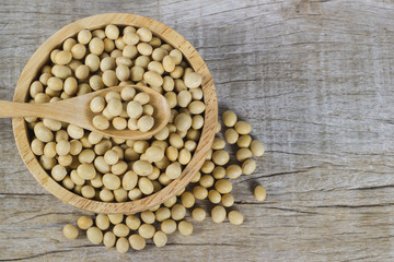 soy bean in the wooden bowl on the wooden floor, have a copy space for your text.
