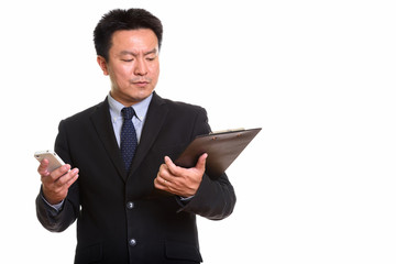 Studio shot of Japanese man isolated against white background