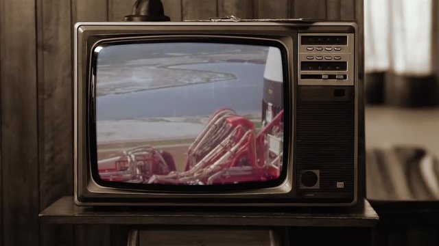 1969. Historical Footage of the NASA Apollo 11 Launch on an Old Retro TV. Sepia Tone. Elements of this video furnished by NASA. Public Domain Footage anf Free for Use.