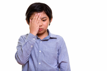 Studio shot of Japanese boy isolated against white background