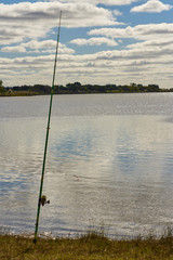 fishing rod on the waters of a lake