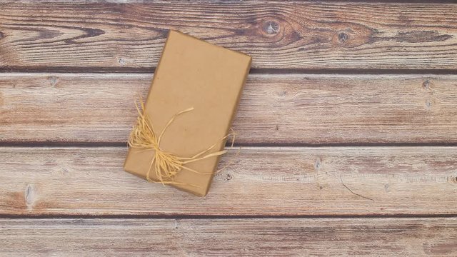 Christmas presents changing on wooden table - Stop motion animation 
