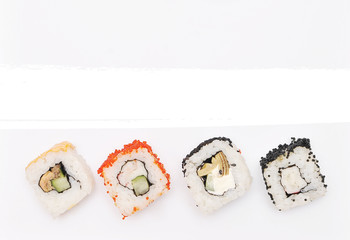 Japanese rolls on white background.