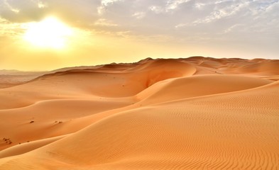 Sunset at the Edge of the Rolling Sand Dunes in the Empty Quarter (Arabian Desert) outside Abu Dhabi, United Arab Emirates
