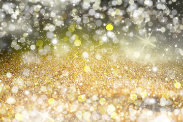 Yellow Sparkling Lights Festive background with texture. Abstract Christmas twinkled bright bokeh...