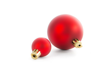 Two beautiful red Christmas balls isolated on white background. Studio shot closeup