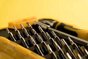 Interchangeable screwdriver set with different types of metal steel heads and bits. Isolated on...