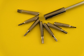 Interchangeable screwdriver set with different types of metal steel heads and bits. Isolated on...