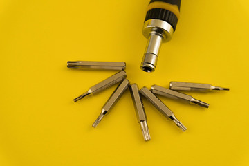 Interchangeable screwdriver set with different types of metal steel heads and bits. Isolated on...