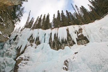 Hiking to Johnston canyon's frozen waterfalls in winter