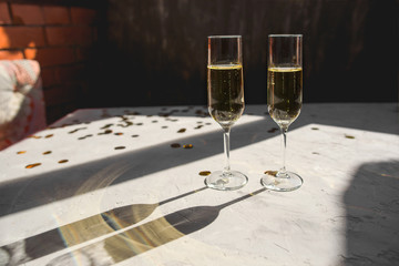 Two glasses of champagne as a symbol of New Year's celebration.
