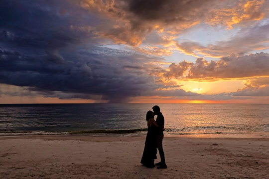 A love couple kiss at Bradenton Beach Florida USA.