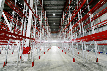 Fototapeta premium Empty storage facilities in the logistics center. Empty shelving in a warehouse.