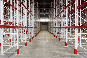 Empty storage facilities in the logistics center. Empty shelving in a warehouse.