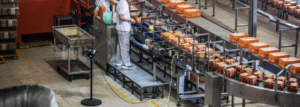 Carbonated drinks factory with view of production and bottles.