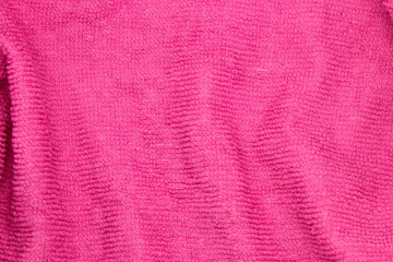 This is a photograph of a Pink textured fabric background