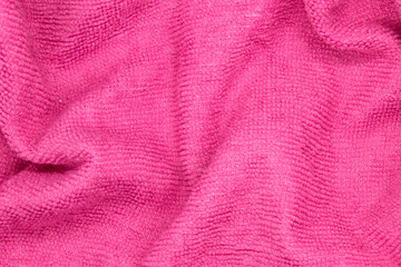 Fototapeta na wymiar This is a photograph of a Pink textured fabric background