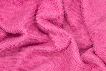 Fototapeta na wymiar This is a photograph of a Pink textured fabric background