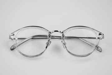 Selective focus close up eye glasses on white background.