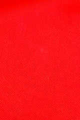 Fototapeta premium This is a photograph of a Vibrant Red textured backdrop
