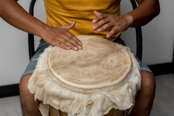 man hands playing cheerful drum