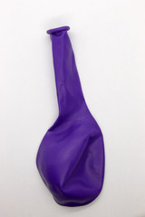 This is a photograph of a Purple Balloon isolated on a White background