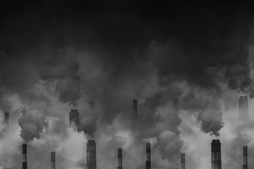 Air pollution smoke from factory chimneys dark scary sky background with space for text
