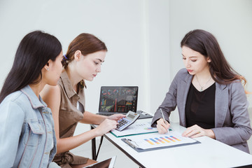 Businesspeople Smart Women Team work meeting together in conference room with company profit  papers at the office.