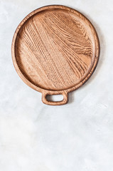 Round Wooden Dish on Grey Background