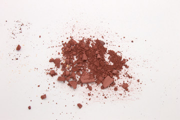 This is a photograph of a Red Brown Matte Powder Eyeshadow isolated on a White Background
