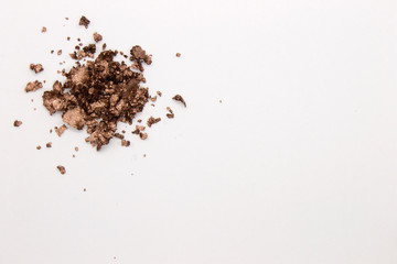 This is a photograph of a Metallic Gold Powder Eyeshadow isolated on a White Background