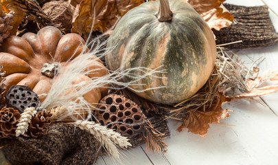 Autumn background with decorative items and pumpkin.