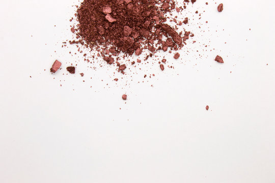 This is a photograph of a Burgundy Powder Eyeshadow isolated on a White Background