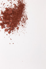 This is a photograph of a Burnt Umber Powder Eyeshadow isolated on a White Background