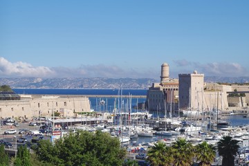 Fototapeta premium Picture of the entrance of the Vieux Port in Marseille, South of France. A very famous place full of history with Saint Jean castle in background.