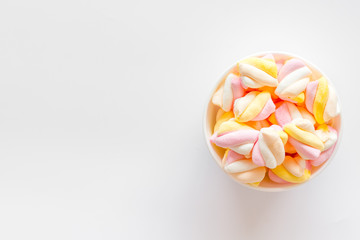 Fluffy dessert. Marshmallows in plate on white table top view space for text