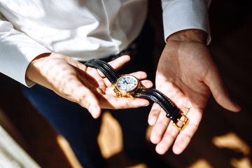 Men's wrist watch, the man is watching the time. Businessman clock, businessman checking time on...